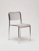 Metal chair with mesh back on a white background